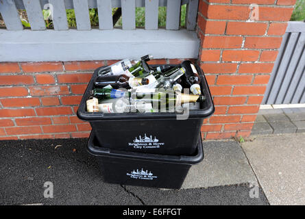 Brighton UK - Recycling boxes full of empty glass bottles for collection by Brighton and Hove City Council Stock Photo