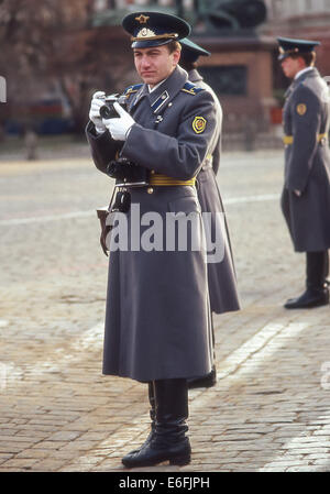 Moscow, Russia. 7th Nov, 1987. A uniformed KGB security guard holding his camera in Red Square before the massive parade celebrating the 70th anniversary of the Bolshevik Revolution of 1917. © Arnold Drapkin/ZUMA Wire/Alamy Live News Stock Photo