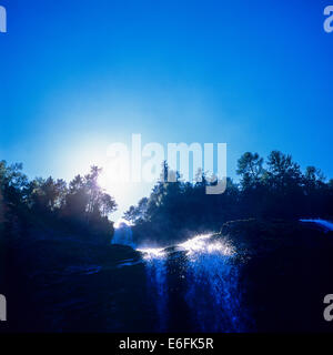 Cascade du Rouget waterfall and sun Savoy French Alps France Stock Photo