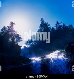 Cascade du Rouget waterfall and sun Savoy French Alps France Stock Photo