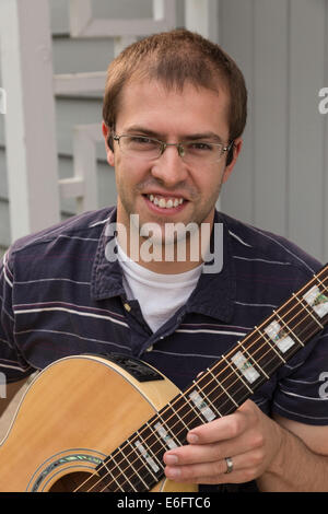 Young Man Playing Acoustic Guitar, USA Stock Photo