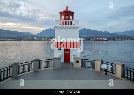 The red and white Brockton Point lighthouse overlooks Coal Harbour in Vancouver, BC, Canada Stock Photo