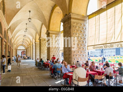 Cafes in a portico by the Palazzo Podesta, Piazza Maggiore, Bologna, Emilia Romagna, Italy Stock Photo