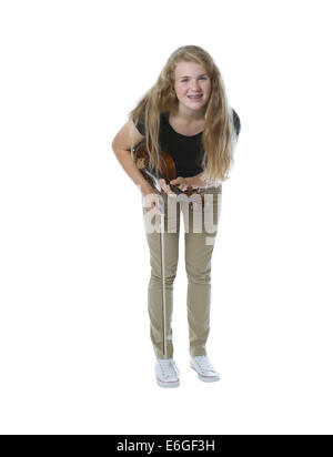 Full body front view, looking forward, of pretty young teenage girl taking a bow after playing the violin isolated on white Stock Photo