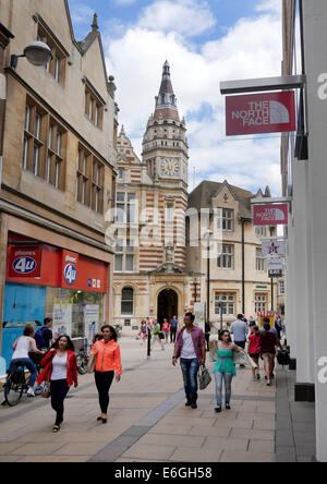 Petty Curry pedestrian shopping street and old Foster Bank Building (Lloyds TSB) with clock tower, central Cambridge, England Stock Photo