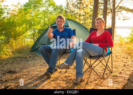 happy and cheerful couple camping on the nature Stock Photo