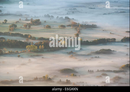 Areal photo of foggy Cerknica lake in dawn. Stock Photo