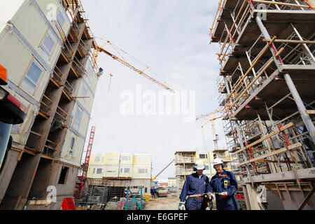 engineers and surveyors inside construction site Stock Photo