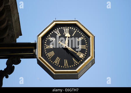 Octagonal clock projecting from the church of St Mary Woolnoth in King William Street, London, England. Stock Photo
