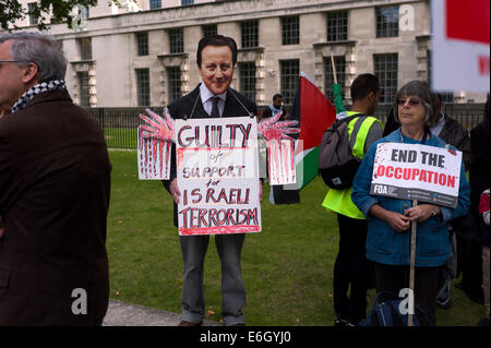 London, UK. 23rd August, 2014. Free Palestine and Free Gaza anti Israeli Demonstration opposite Prime Minister Cameron's residence Downing Street in Whitehall, London EnglandUK. 23 August 2014 Prime Minister David Cameron look alike with blood on his hands. Credit:  BRIAN HARRIS/Alamy Live News