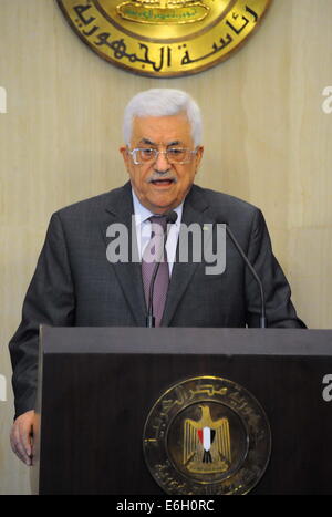 Cairo, Egypt. 24th Aug, 2014. Palestinian President Mahmoud Abbas speaks during a news conference after meeting with Egyptian President Abdel Fattah al-Sisi at the Presidential Palace in Cairo August 23, 2014, seen in this handout photo provided by the Egyptian Presidency. Abbas called on Saturday for a swift resumption of the Cairo-mediated talks between Israel and the Palestinians that failed last week to put an end to the Gaza crisis. APAimages /The Egyptian Defence Ministry/Handout via APAimages. Credit:  The Egyptian Defence Ministry/APA Images/ZUMA Wire/Alamy Live News Stock Photo