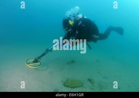 Diver with the metal detector searching for underwater treasure, lake Baikal, Siberia, Russia, Eurasia Stock Photo