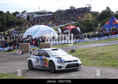 Baumholder, Germany. 23rd Aug, 2014. Jari-Matti Latvala and co-driver Mikka Anttila (both Finland) pass the special stage of the ADAC Rally Deutschland part of the WRC Rally Championships at the military training grounds in Baumholder, Germany, 23 August 2014. Photo: THOMAS FREY/dpa/Alamy Live News Stock Photo