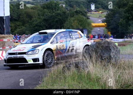 Baumholder, Germany. 23rd Aug, 2014. Jari-Matti Latvala and co-driver Mikka Anttila (both Finland) pass the special stage of the ADAC Rally Deutschland part of the WRC Rally Championships at the military training grounds in Baumholder, Germany, 23 August 2014. Photo: THOMAS FREY/dpa/Alamy Live News Stock Photo
