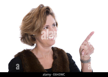 Isolated businesswoman in winter clothes presenting with her forefinger over white background. Stock Photo