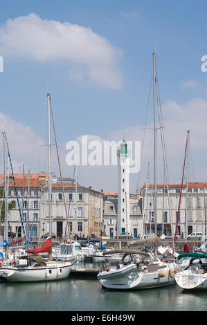 Old lighthouse, Feu Postérieur, seen through masts of boats La Rochelle harbour, Charente-Maritime, France, Europe Stock Photo
