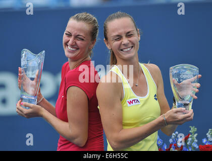 New Haven, CT USA--Wimbledon champion Petra Kvitova (CZE), left, and Magdalena Rybarikova (SVK) share a laugh as they pose for trophy pictures at the Connecticut Open Tennis Tournament. Kvitova defeated Rybarikova 6-4,6-2 to win the tournament. August 22, 2014. Credit:  Enigma/Alamy Live News Stock Photo