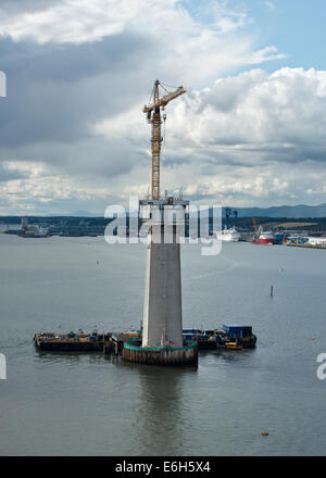 Queensferry Crossing Bridge - tower being constructed in the Firth of Forth. Rosyth shipyard in background.