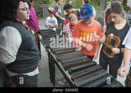 Park guests shopping for magic wands in The Wizarding World of Harry Potter at Universal Studios Islands of Adventure Stock Photo