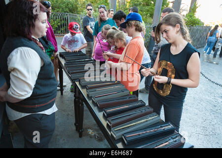 Park guests shopping for magic wands in The Wizarding World of Harry Potter at Universal Studios Islands of Adventure Stock Photo