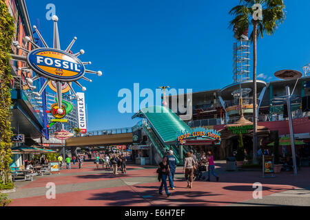 Shoppers and park guests walk through Universal's City Walk in Orlando, Florida Stock Photo