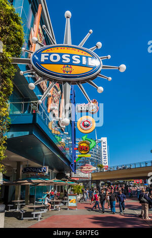 Shoppers and park guests walk through Universal's City Walk in Orlando, Florida Stock Photo
