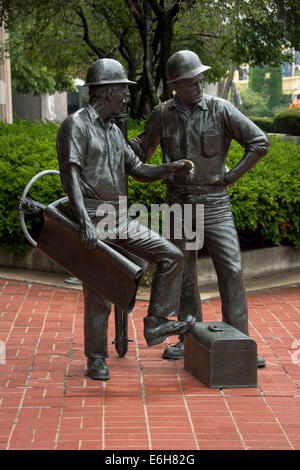 The Builders Sculpture on Pittsburgh's North Shore is a tribute to the city's “renaissance”construction workers. Stock Photo
