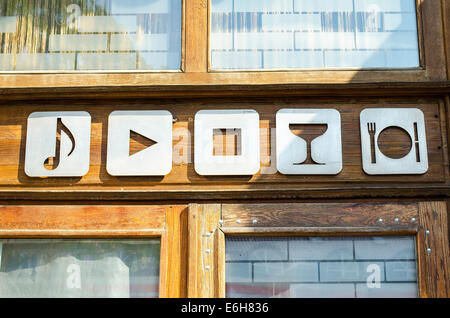 White Bar Icons Set On Wooden Wall Stock Photo