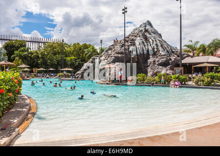 Lifeguard keeps an eye on guests enjoying the swimming pool at the Polynesian Resort in Walt Disney World, Florida Stock Photo