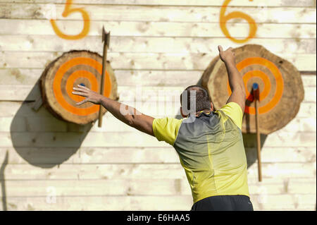 Maetaguse, Estonia. 23rd Aug, 2014. A player competes in the Nordic axe throwing championship in Maetaguse, Estonia, on Aug. 23, 2014. More than 100 best axe throwers from Denmark, Sweden, Finland and Estonia compete in the Nordic axe throwing championship, which lasts from 22 to 23 of August. © Sergei Stepanov/Xinhua/Alamy Live News Stock Photo