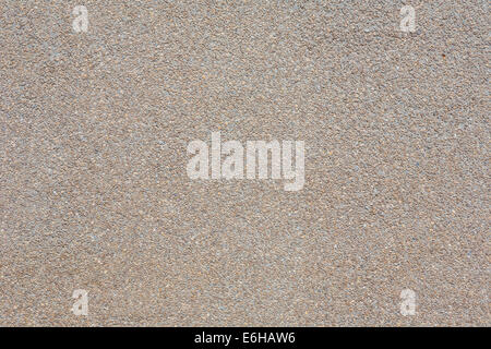 Close up of exposed aggregate concrete wall panel with brown colored concrete Stock Photo