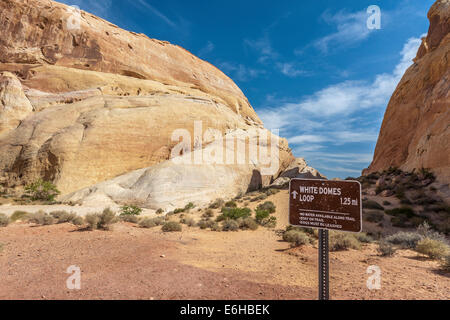 Sign leads hikers through the White Domes Loop trail in Valley of Fire State Park near Overton, Nevada Stock Photo