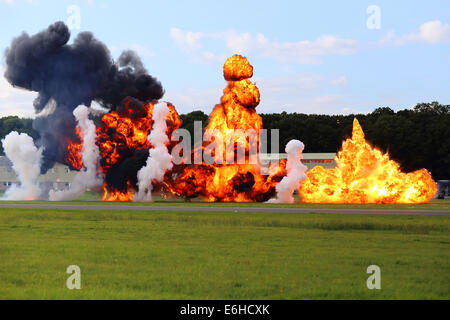 Dunsfold, UK. 23rd Aug, 2014. 'Wings and Wheels' airshow Dunsfold: Dunsfold Park Airfield under enemy attack re-enactment during Wings and Wheels air show; Surrey; England Credit:  Beata Moore/Alamy Live News Stock Photo