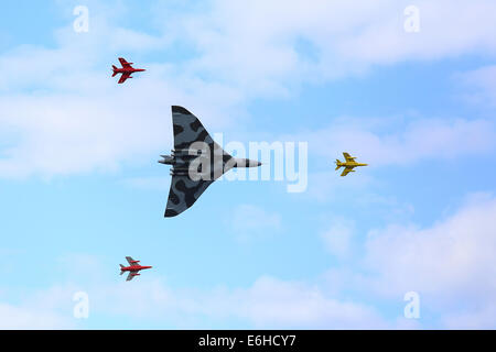 Dunsfold, UK. 23rd Aug, 2014. 'Wings and Wheels' airshow Dunsfold: Vulcan bomber flying above Dunsfold Airfield, Surrey, England Credit:  Beata Moore/Alamy Live News Stock Photo