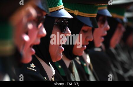 Kabul, Afghanistan. 24th Aug, 2014. Newly-graduated female Afghan National Army (ANA) officers take oath during their graduation ceremony in Kabul, Afghanistan on Aug. 24, 2014. A total of 30 female army officers graduated from Kabul Military Training Center (KMTC) on Sunday and commissioned to ANA, General Aminullah Paktiani commander of KMTC said. Credit:  Ahmad Massoud/Xinhua/Alamy Live News Stock Photo