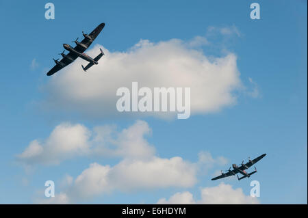 Battle of Britain Memorial Flight with Avro Lancasters PA474 'Thumper' and the Canadian Warplane Heritage Museum's 'Vera' at the Dawlish Air Show. Stock Photo