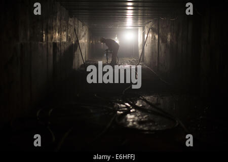 Tehran, Iran. 24th Aug, 2014. August 24, 2014 - Tehran, Iran - An Iranian worker works at a workshop of the northern part of Tehran's Subway Line 3. Subway line 3 with 37 km (23 miles) long and 28 stations will be the main public transportation and connection between southwest and northeast of Tehran. Morteza Nikoubazl/ZUMAPRESS © Morteza Nikoubazl/ZUMA Wire/Alamy Live News Stock Photo