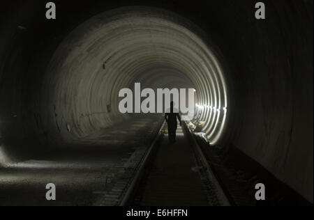 Tehran, Iran. 24th Aug, 2014. August 24, 2014 - Tehran, Iran - An Iranian worker walks along a tunnel of the northern part of Tehran's Subway Line 3. Subway line 3 with 37 km (23 miles) long and 28 stations will be the main public transportation and connection between southwest and northeast of Tehran. Morteza Nikoubazl/ZUMAPRESS © Morteza Nikoubazl/ZUMA Wire/Alamy Live News Stock Photo