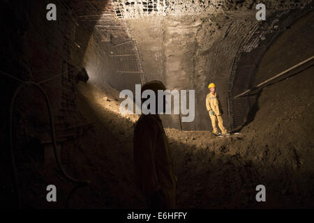 Tehran, Iran. 24th Aug, 2014. August 24, 2014 - Tehran, Iran - Two workers rest as they stand at a workshop of the northern part of Tehran's Subway Line 3. Subway line 3 with 37 km (23 miles) long and 28 stations will be the main public transportation and connection between southwest and northeast of Tehran. Morteza Nikoubazl/ZUMAPRESS © Morteza Nikoubazl/ZUMA Wire/Alamy Live News Stock Photo