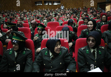 Kabul, Afghanistan. 24th Aug, 2014. Newly-graduated female Afghan National Army (ANA) officers attend the graduation ceremony in Kabul, Afghanistan on Aug. 24, 2014. A total of 30 female army officers graduated from Kabul Military Training Center (KMTC) on Sunday and commissioned to ANA, General Aminullah Paktiani commander of KMTC said. Credit:  Ahmad Massoud/Xinhua/Alamy Live News Stock Photo