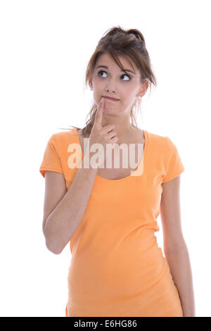 Portrait of a thoughtful isolated young girl in orange shirt looking sideways. Stock Photo