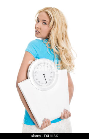 Beautiful isolated young woman with body balance looking desperate. Concept for eating disorders. Stock Photo