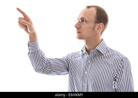 Isolated serious man in blue shirt pointing with his finger sideways on text. Stock Photo