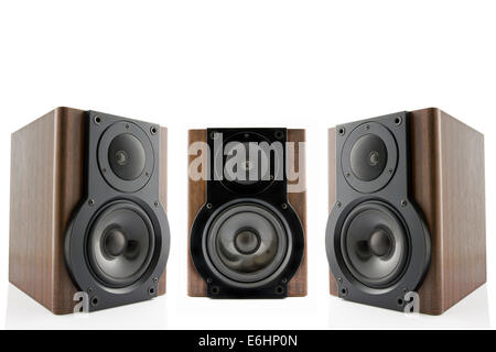 Three modern audio speakers in classic wooden casing isolated on white background Stock Photo