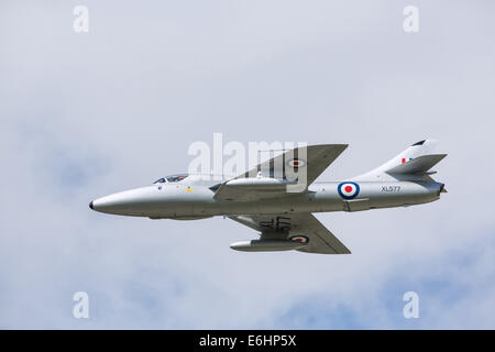 Dunsfold, UK. 23rd Aug, 2014. Dunsfold aerodrome in Surrey holds an annual motor and airshow over the August Bank Holiday weekend.  Here  Hawker Hunter jet aircraft XL577, owned by Midair Squadron displays on Saturday 23rd Credit:  Niall Ferguson/Alamy Live News Stock Photo