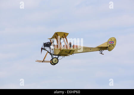 Dunsfold, UK. 23rd Aug, 2014. Dunsfold aerodrome in Surrey holds an annual motor and airshow over the August Bank Holiday weekend.  Here a replica BE2 British two-seater biplane takes part in a 'dogfight' with other members of the Great War Display Team Credit:  Niall Ferguson/Alamy Live News Stock Photo