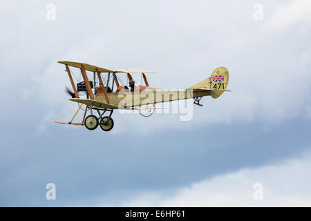 Dunsfold, UK. 23rd Aug, 2014. Dunsfold aerodrome in Surrey holds an annual motor and airshow over the August Bank Holiday weekend.  Here a replica BE2 British two-seater biplane takes part in a 'dogfight' with other members of the Great War Display Team Credit:  Niall Ferguson/Alamy Live News Stock Photo