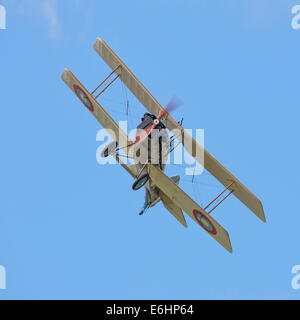 Dunsfold, UK. 23rd Aug, 2014. Dunsfold aerodrome in Surrey holds an annual motor and airshow over the August Bank Holiday weekend.  Here replica Great War SE5A fighter takes part in a 'dogfight' with other members of the Great War Display Team Credit:  Niall Ferguson/Alamy Live News Stock Photo