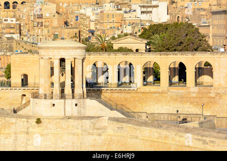 The Siege Bell Tower Memorial on the walls overlooking the Grand Harbour seen from cruise ship Valletta Malta Stock Photo