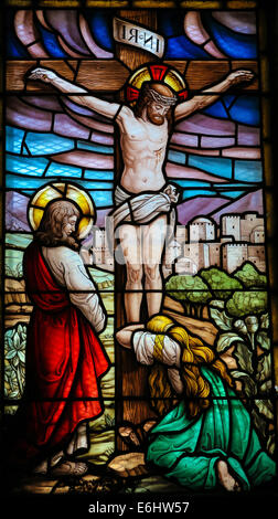 Stained glass window depicting the Crucifixion of Jesus Christ Stock Photo
